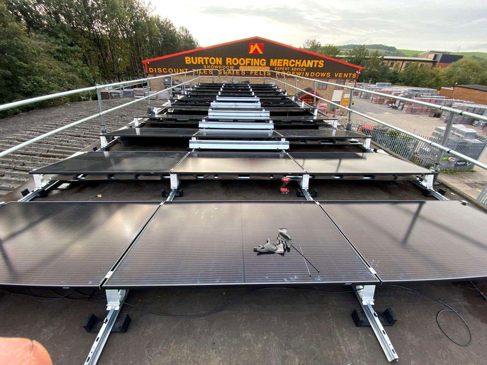 Ballasted solar array being installed on a flat commercial roof